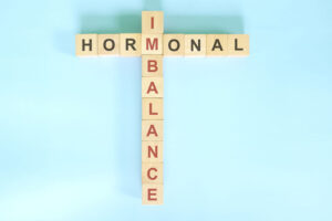 Hormonal imbalance concept using wooden blocks.